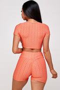 Thumbnail of Conjunto de top corto texturizado y pantalón corto biker