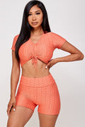 Thumbnail of Conjunto de top corto texturizado y pantalón corto biker
