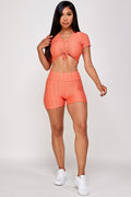 Thumbnail of Conjunto de top corto texturizado y pantalón corto biker