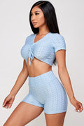 Thumbnail of Conjunto de top corto texturizado y pantalón corto biker