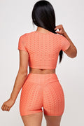 Thumbnail of Conjunto de top corto texturizado y pantalón corto biker